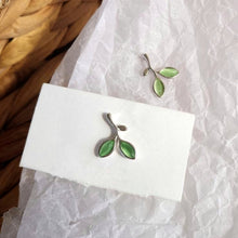 Load image into Gallery viewer, Silver and green pair of stud earrings in the shape of leaves