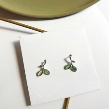 Load image into Gallery viewer, Silver and green pair of stud earrings in the shape of leaves